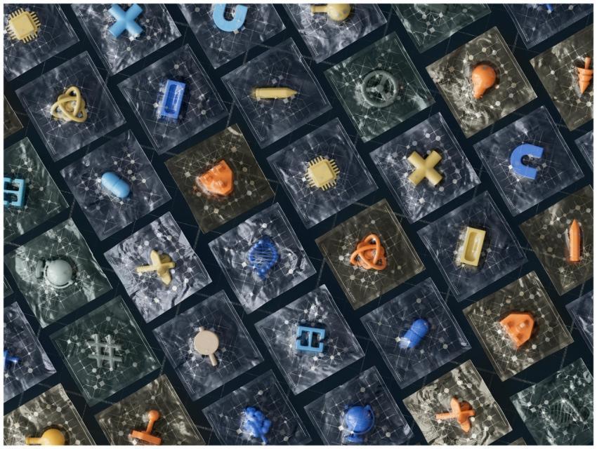 Abstract arrangement of 3D technology icons on a g