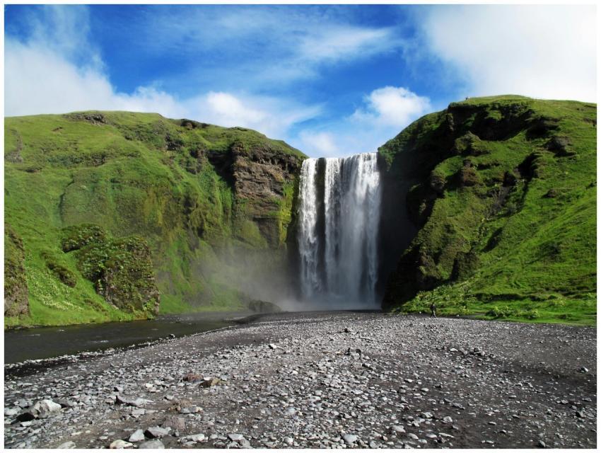 A breathtaking view of a waterfall cascading amids