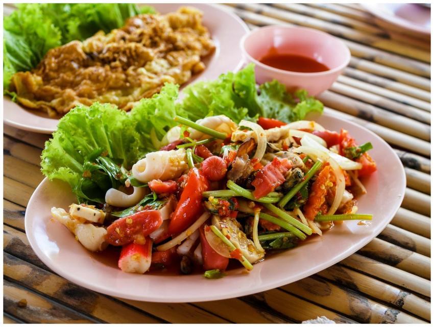 Authentic Thai seafood salad with fresh vegetables
