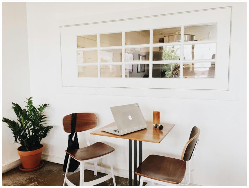 A modern, minimalist workspace featuring a laptop
