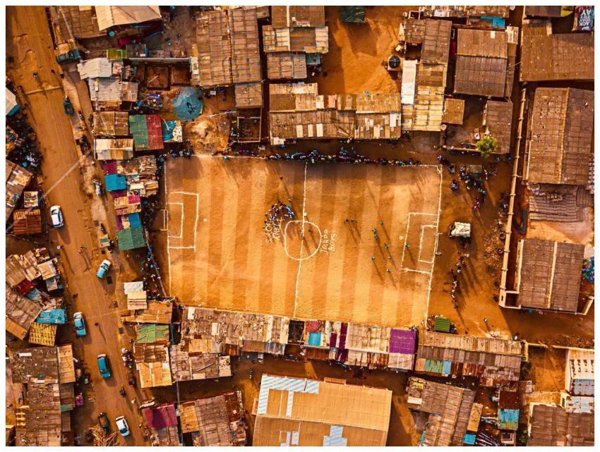Aerial shot of an urban football field surrounded