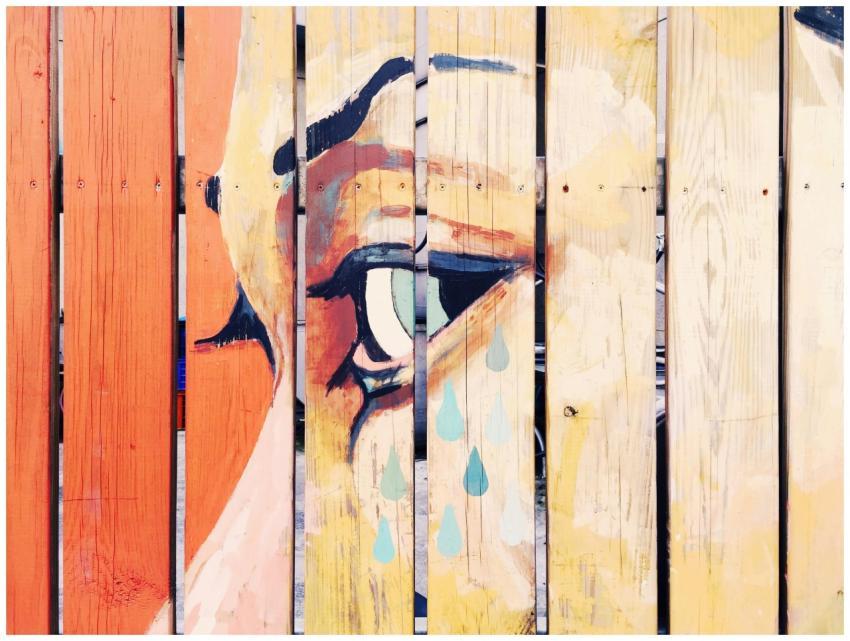 Vivid artistic mural depicting a crying eye painte