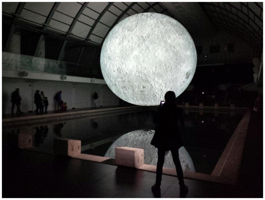Captivating indoor display of a large moon replica