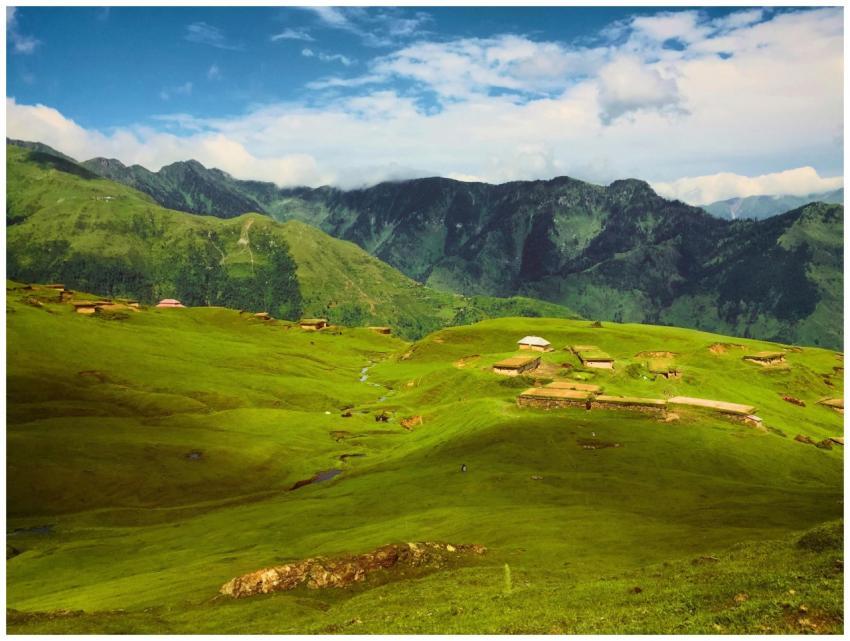 Breathtaking view of lush green hills and mountain