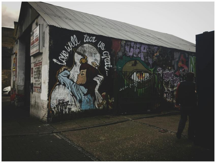 Graffiti on a building wall depicting street art a