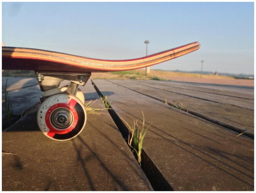 Close-up of a skateboard wheel on a wooden boardwa