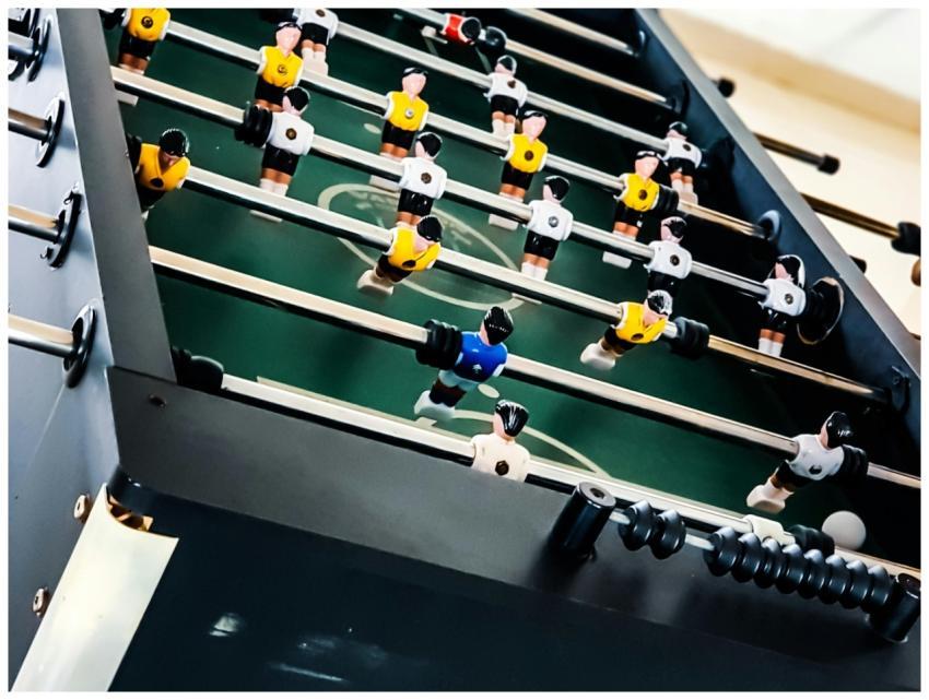 Vibrant foosball table capturing an intense soccer