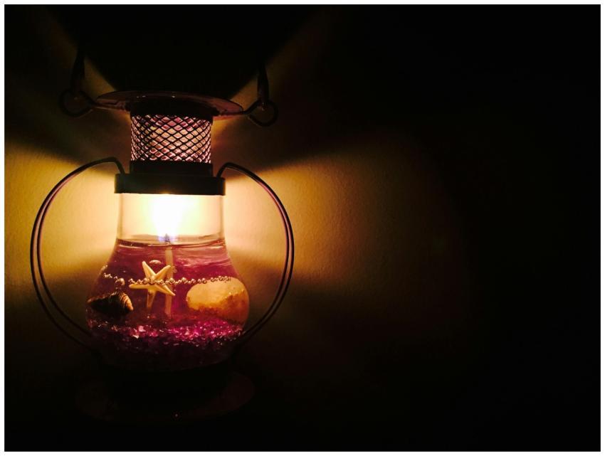 Warm and inviting candle lantern with starfish and