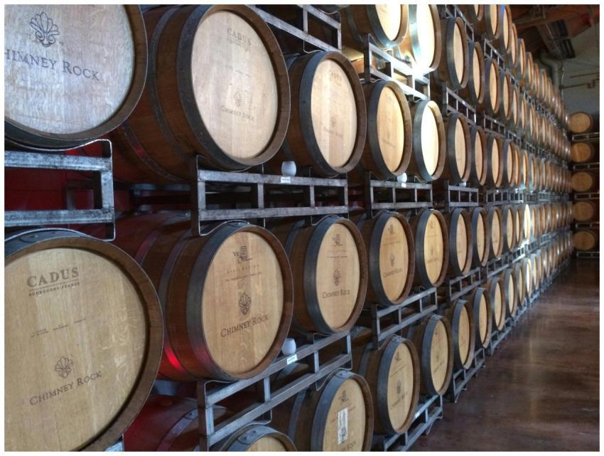 Wooden wine barrels in a Napa, CA winery, ideal fo