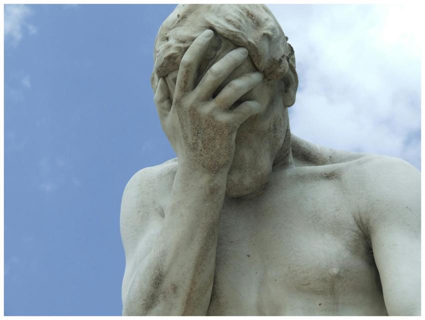 A dramatic close-up of a renowned statue in Paris