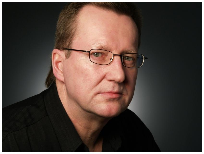 Close-up portrait of a serious businessman in eyeg