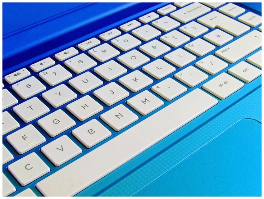 Detailed close-up image of a white computer keyboa