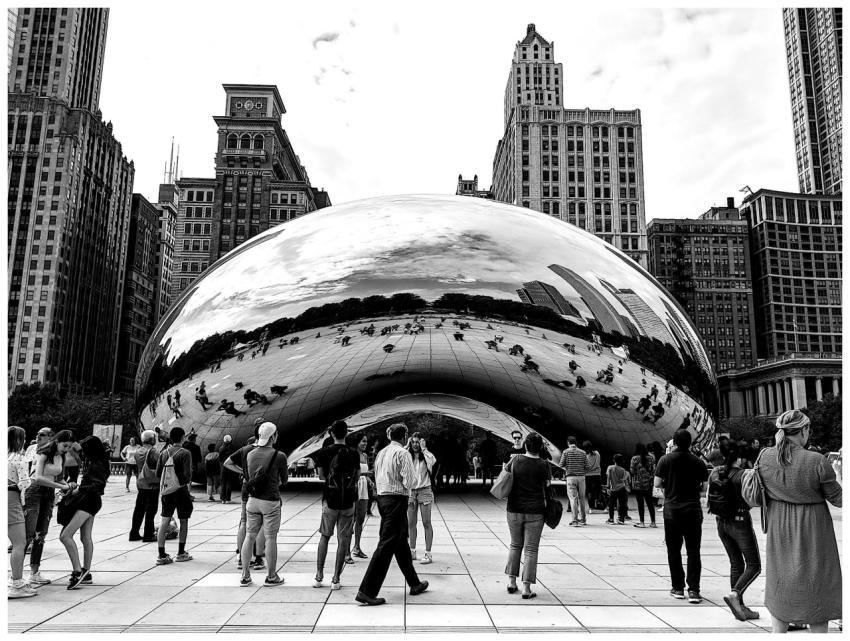 A grayscale image capturing Cloud Gate sculpture w