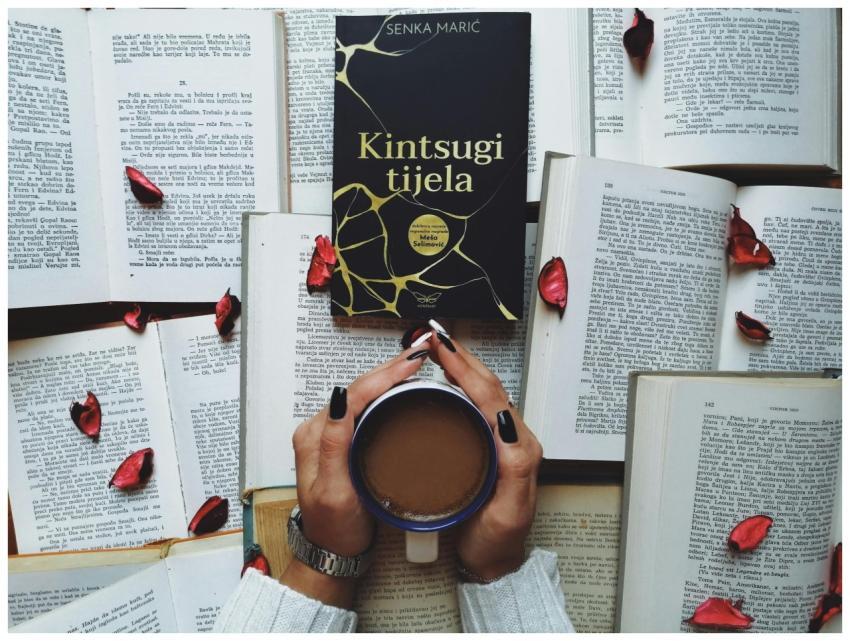 A serene scene featuring a book, cup of coffee, an