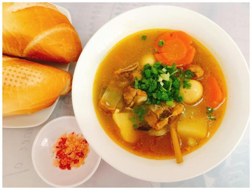 A hearty Vietnamese soup served with fresh baguett