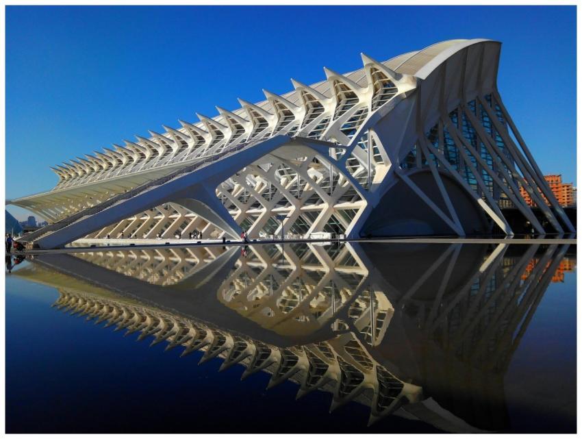 Modern architectural marvel reflecting in calm wat