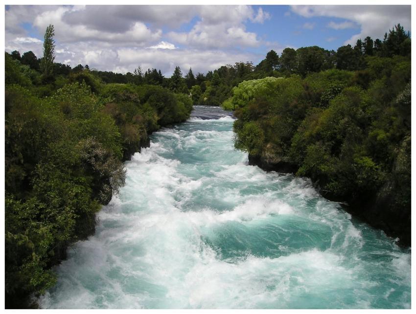 Vibrant and powerful river rapids flowing through