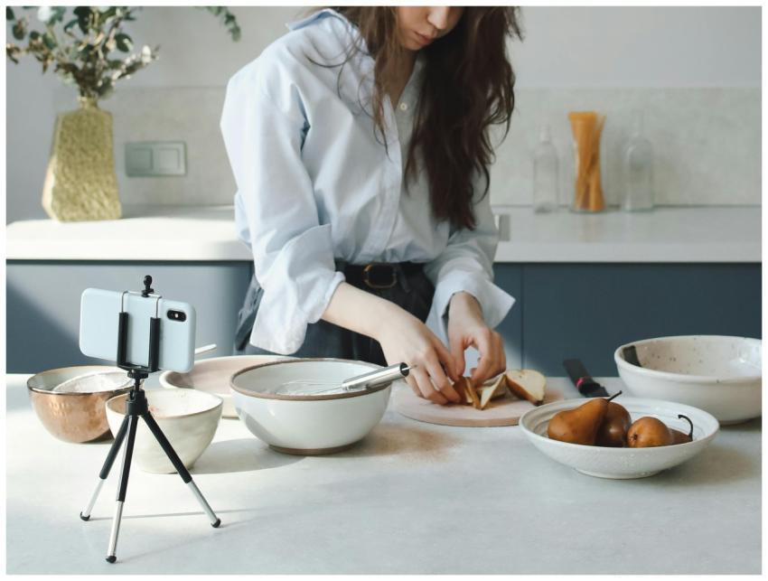 A woman preparing ingredients in a modern kitchen