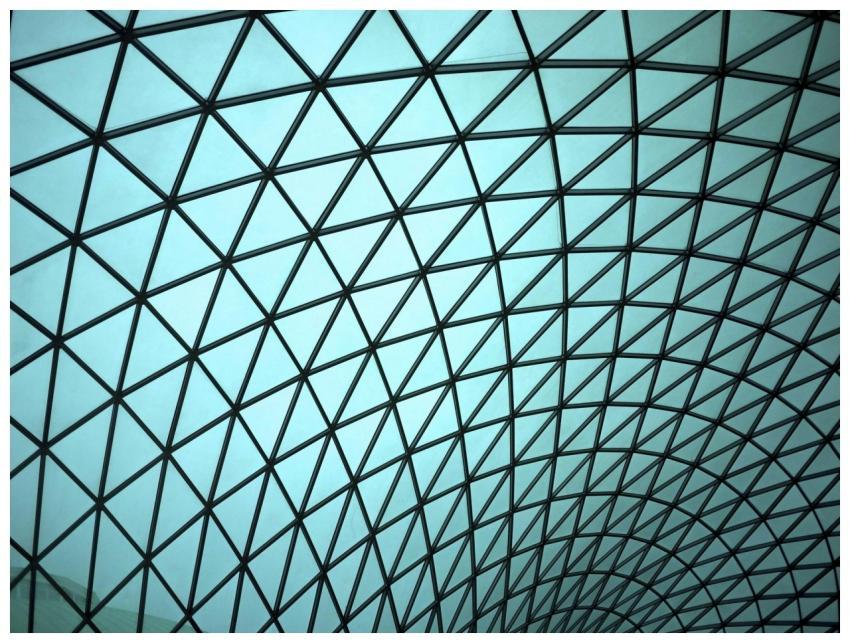 Modern geometric glass ceiling displaying intricat