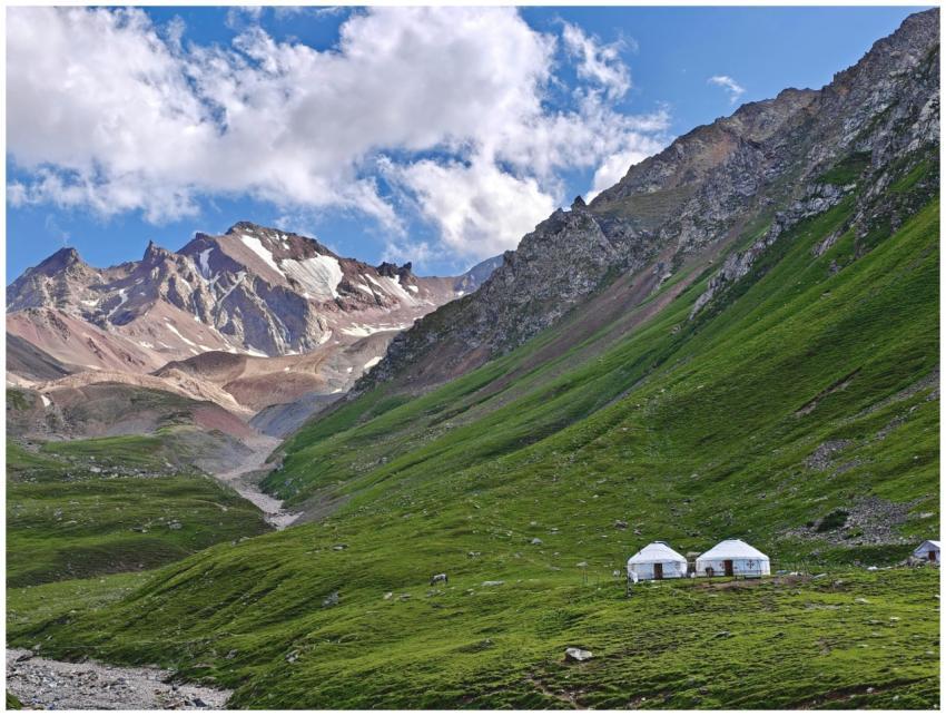 Scenic view of mountains and yurts in Ili Kazakh A