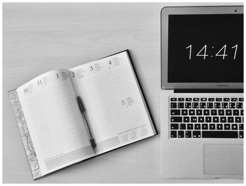 Minimalist office workspace with a notebook and Ma