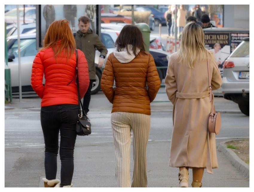 Women Walking Sidewalk Together