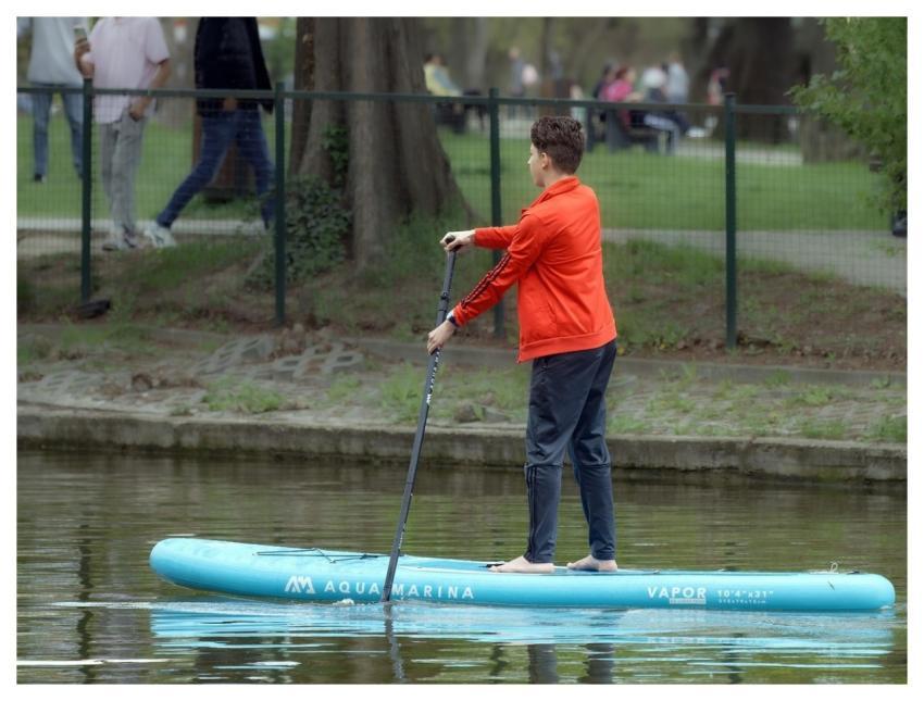 Boy Rowing Kayak Boat