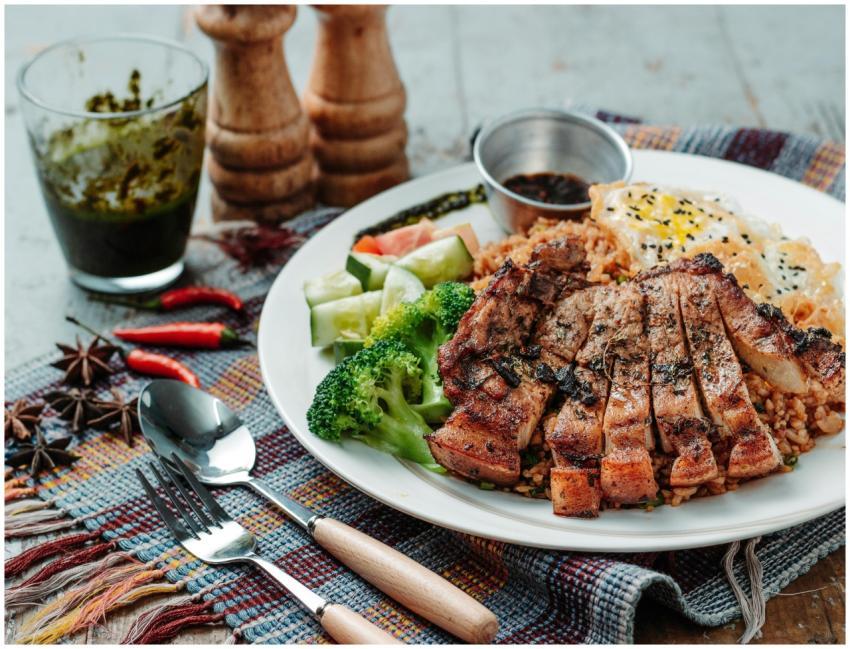 Delicious grilled pork with broccoli, cucumber, an