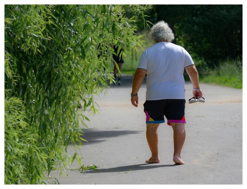 Man Barefoot Walking Alley