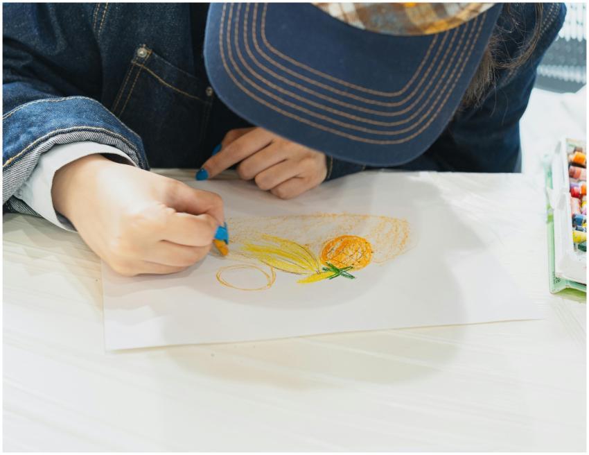 A young student engaged in a still life drawing se