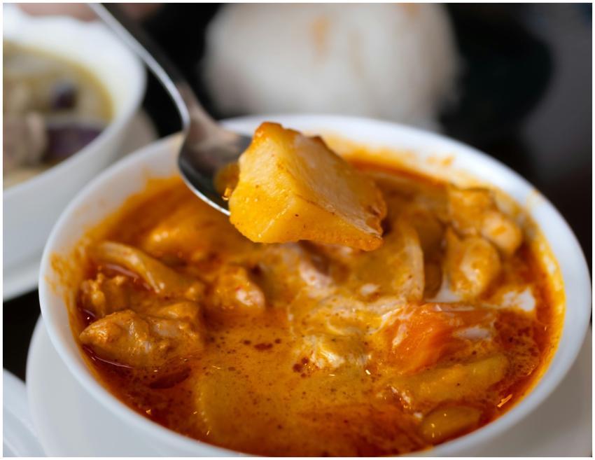 Close-up of a vibrant curry dish with fresh ingred