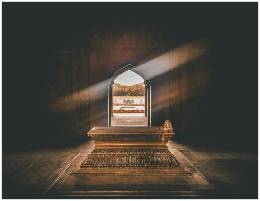 Beautiful tomb interior with a golden sarcophagus,