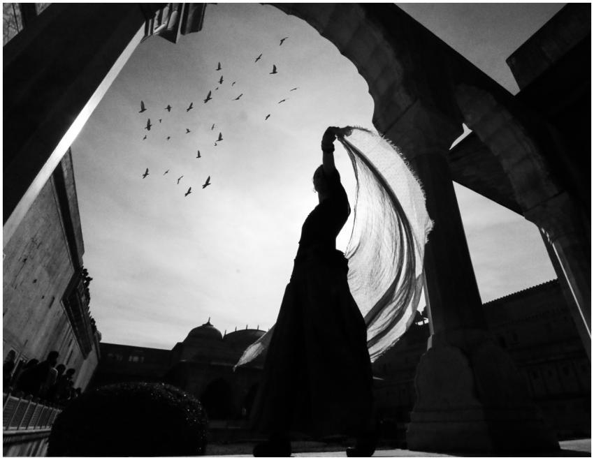 Artistic silhouette of a dancer with flowing fabri