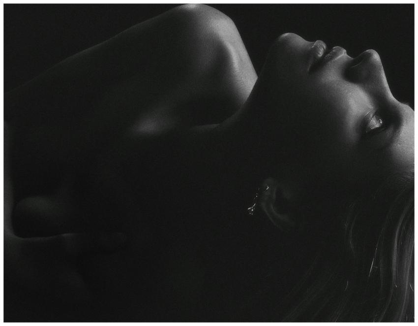 An artistic black and white portrait of a woman's