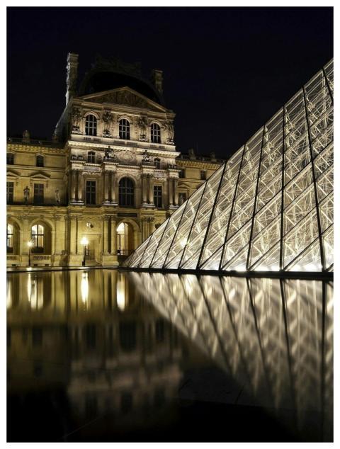Stunning view of the Louvre Pyramid illuminated at