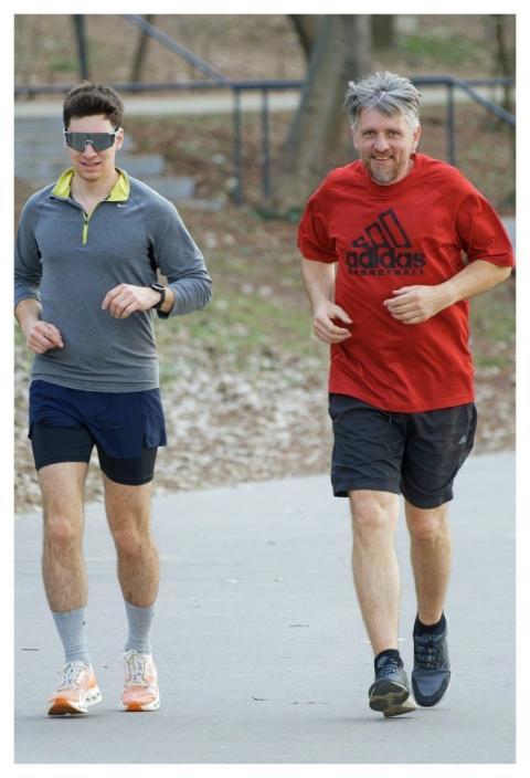 Men Running Together Alley