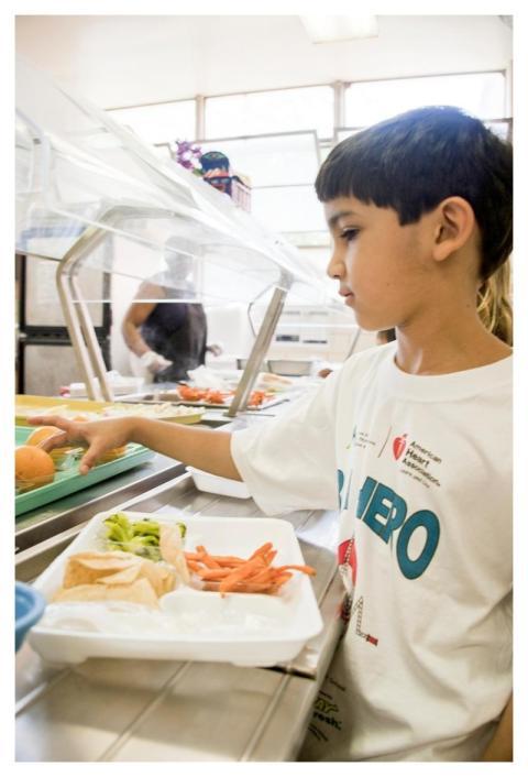 A boy entering the line for lunch. Original image