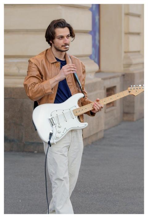 Boy Casual Playing Guitar