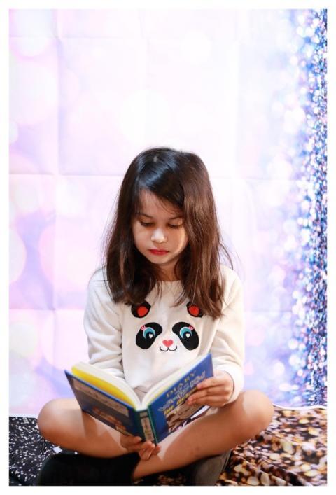 Kid Reading Serious Book