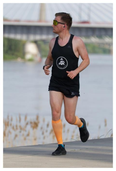 Man Jogging River Bank Young