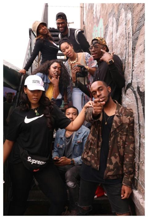 A diverse group of young adults having fun and pos