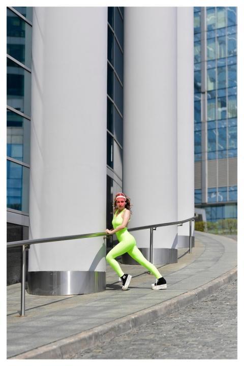 Young Woman Sports Tracksuit Pose