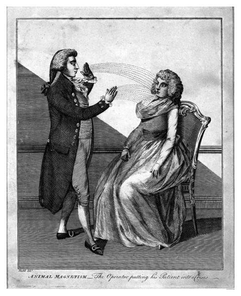 man hypnotising woman using animal