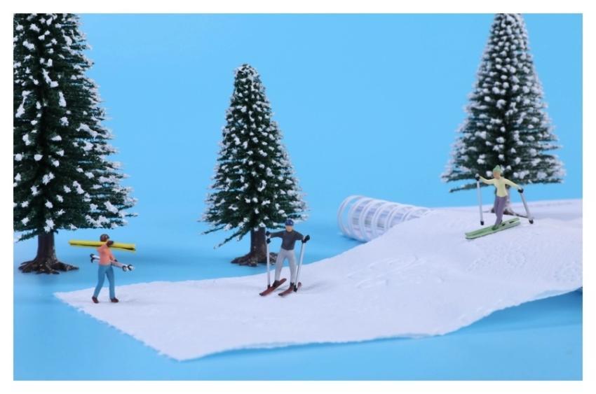 Miniature snow skiers, sport advertising