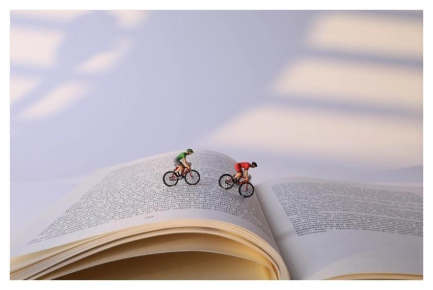 Book cyclists, miniature sport advertising