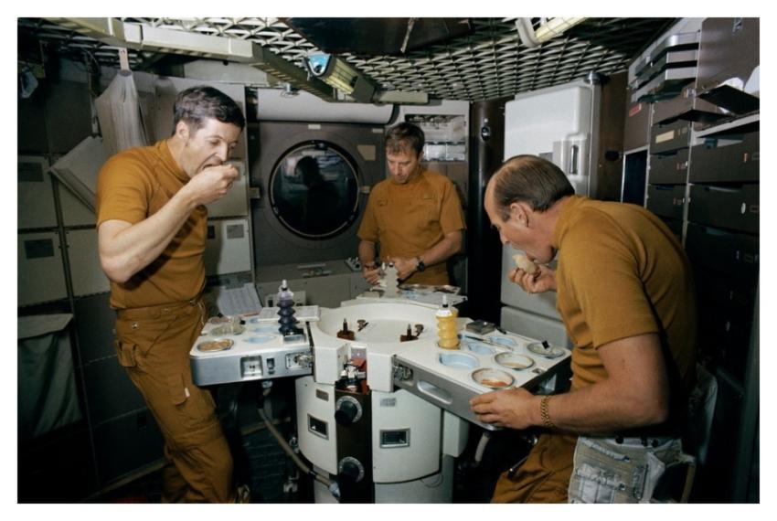 Skylab Crew Members Dine on Specially Prepared Spa
