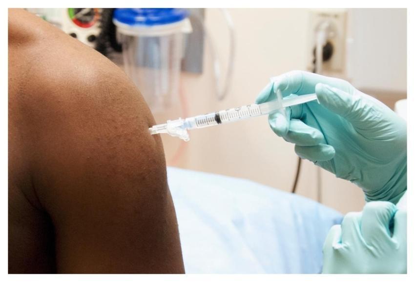 A man receiving a dose of the investigational NIAI