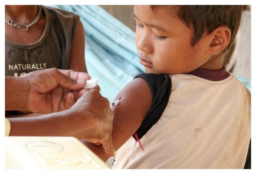 A Cambodian boy receiving his injection of measles