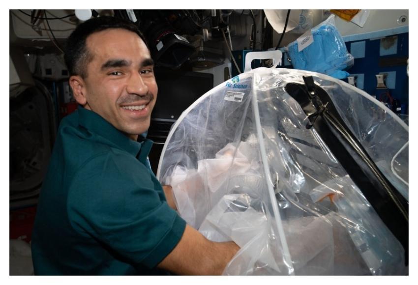Astronaut Raja Chari works on the Food Physiology
