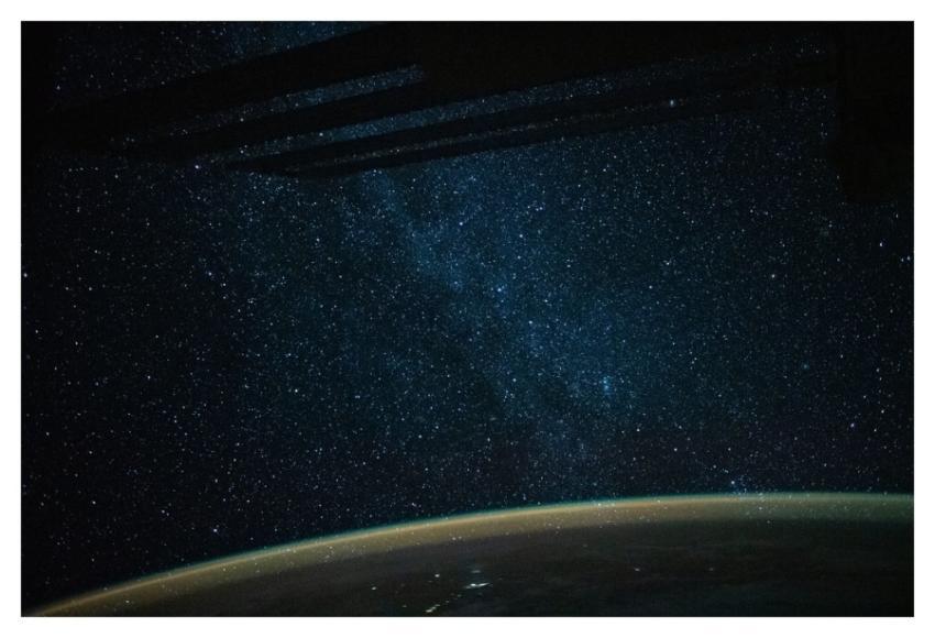 The Milky Way lights up an orbital night pass
